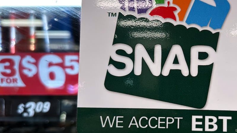 FILE - SNAP EBT information sign is displayed at a gas station in Riverwoods, Ill., Saturday,...